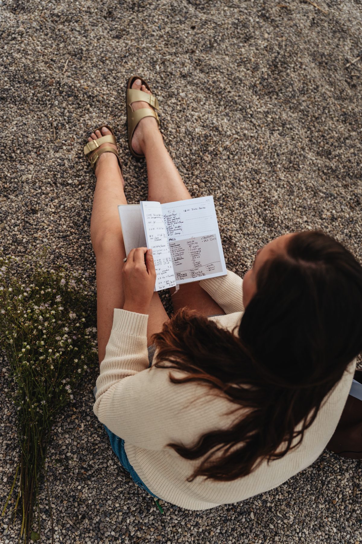 Virginia journaling her morning plans outside